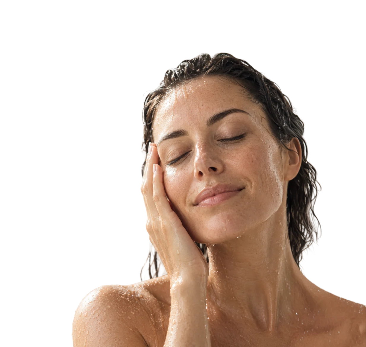Woman with wet hair smiling with her eyes closed in the shower
